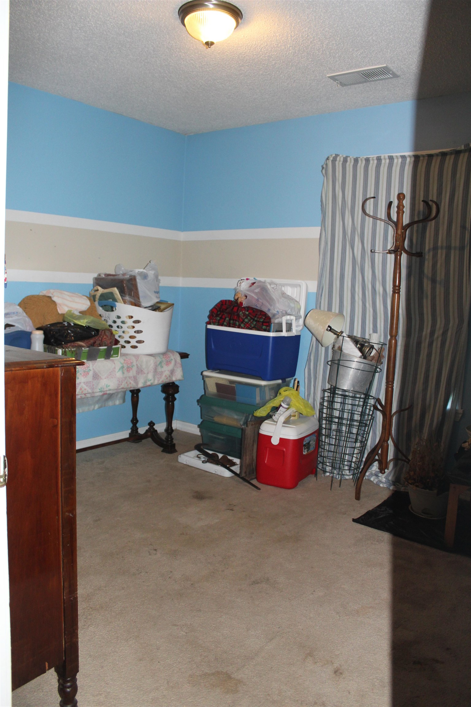 1039 Hyde Road Ripley, TN 38063 - Photo 13 of 21 a bedroom with furniture and a chandelier