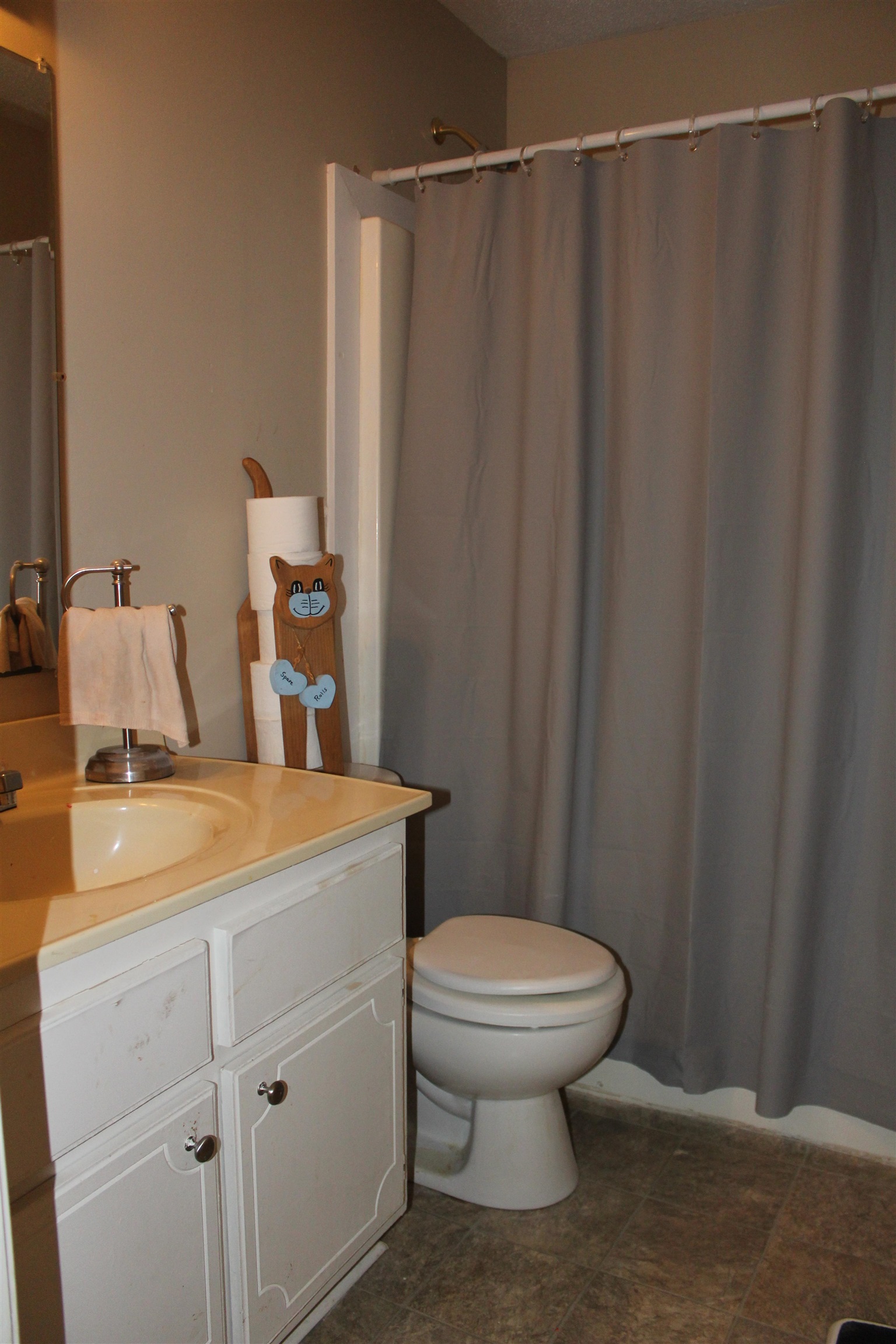 1039 Hyde Road Ripley, TN 38063 - Photo 14 of 21 a bathroom with a sink a toilet and shower