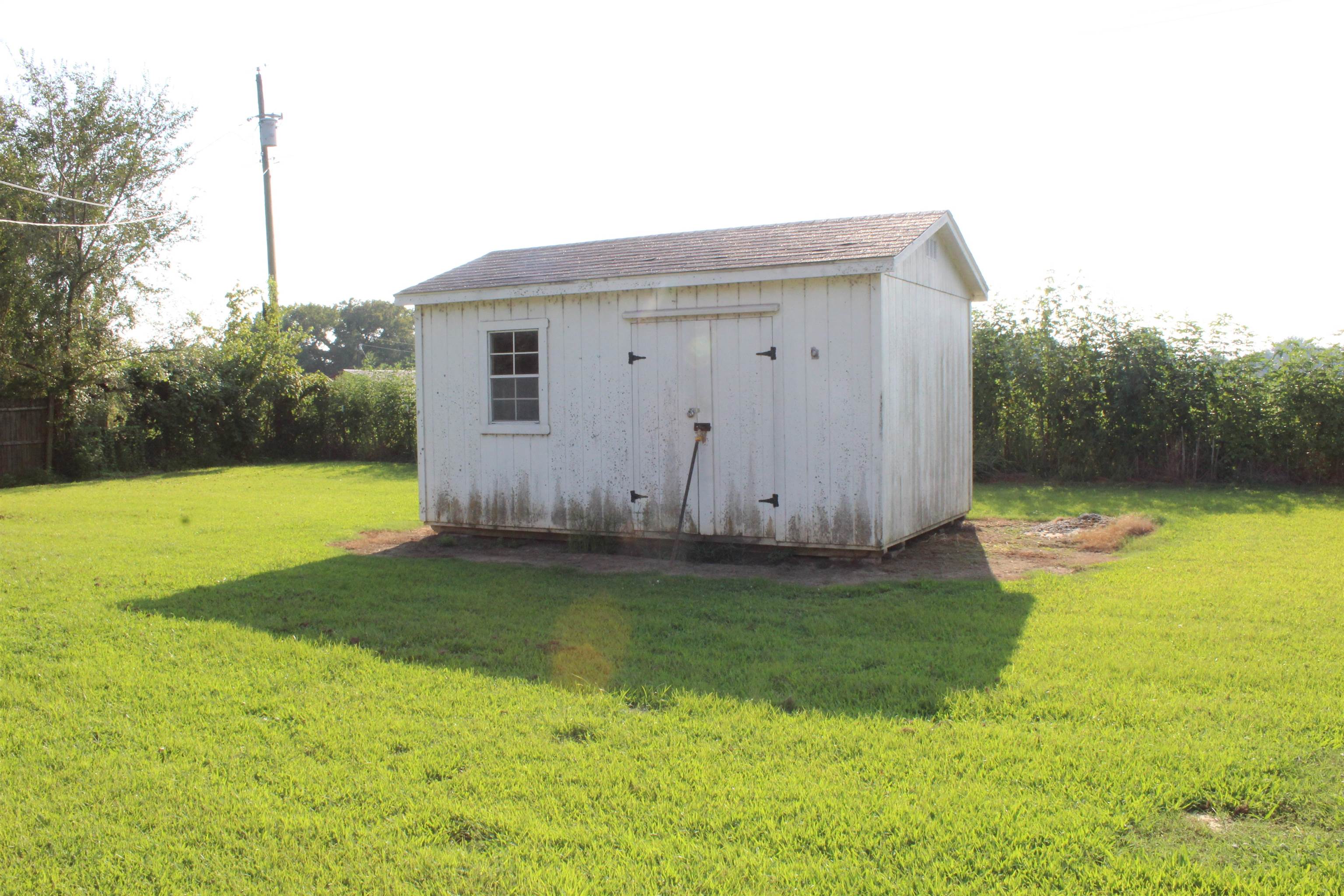 1039 Hyde Road Ripley, TN 38063 - Photo 19 of 21 a backyard of a house with lots of green space