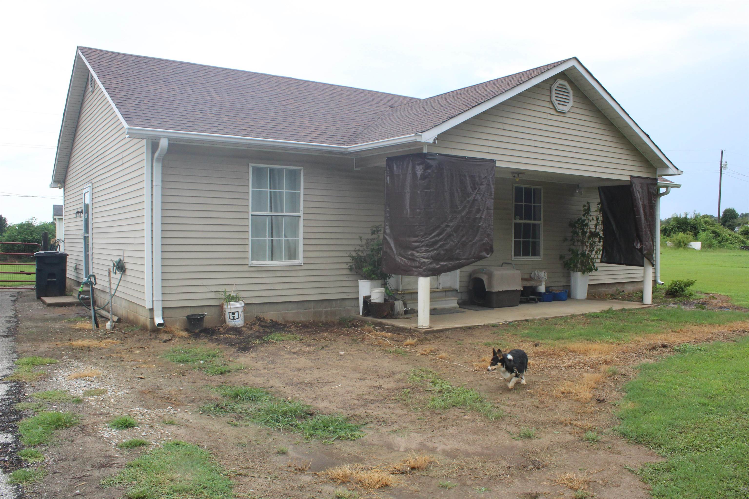 1039 Hyde Road Ripley, TN 38063 - Photo 21 of 21 a front view of a house with garden