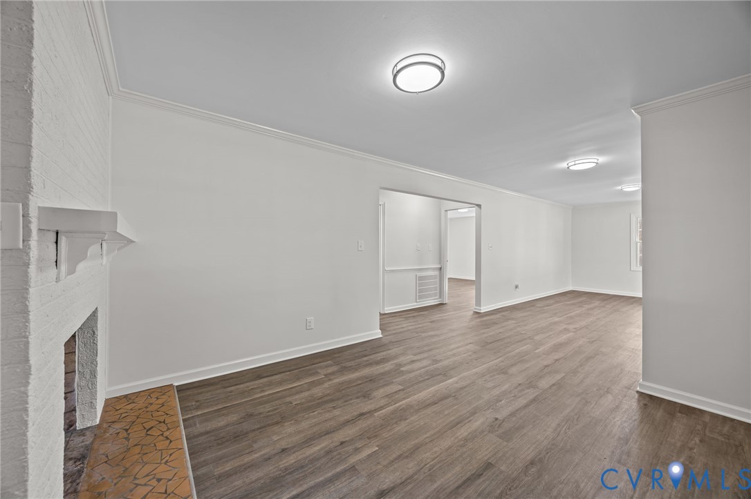 114 Huntington Road Colonial Heights, VA 23834 - Photo 11 of 40 a view of an empty room with wooden floor and a window