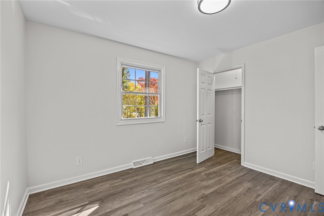114 Huntington Road Colonial Heights, VA 23834 - Photo 21 of 40 a view of an empty room with wooden floor and a window