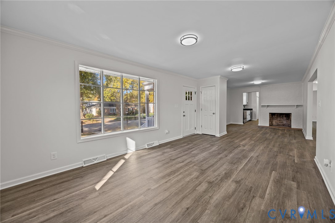 114 Huntington Road Colonial Heights, VA 23834 - Photo 9 of 40 a view of empty room with wooden floor and fireplace