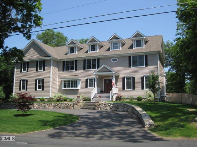 40 South Olmstead Lane Ridgefield, CT 06877 - Photo 1 of 1 a front view of a house with a garden