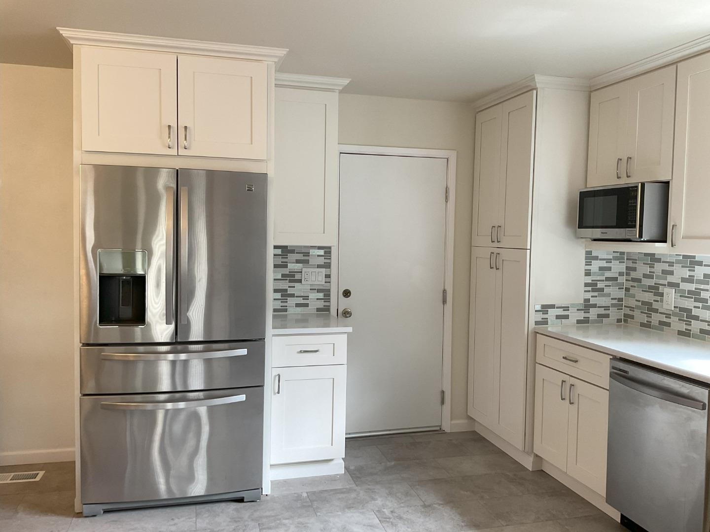 3057 Berney Drive Marina, CA 93933 - Photo 12 of 24 a kitchen with stainless steel appliances granite countertop a refrigerator and a sink