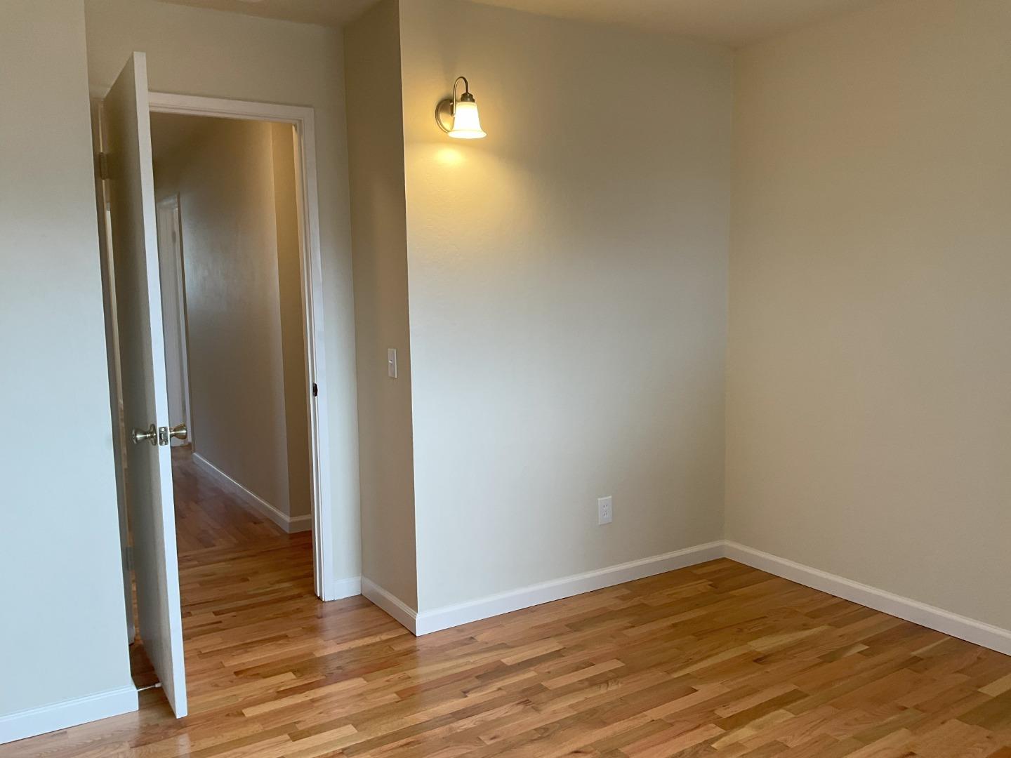 3057 Berney Drive Marina, CA 93933 - Photo 19 of 24 a view of empty room with wooden floor