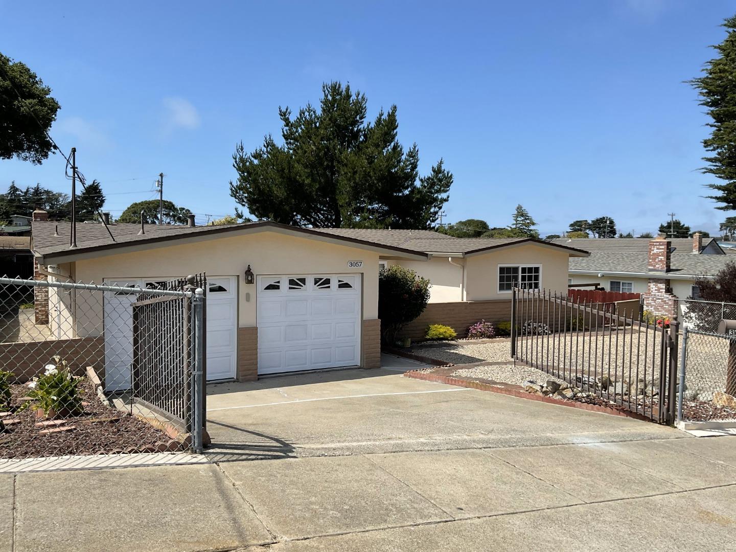 3057 Berney Drive Marina, CA 93933 - Photo 2 of 24 a front view of a house with a garage