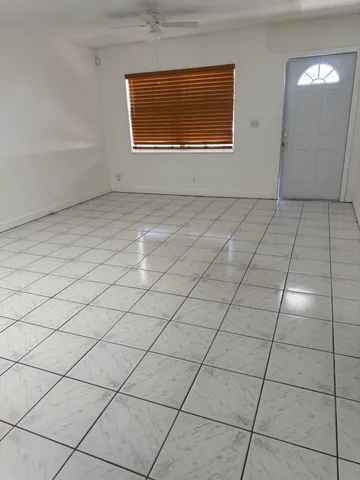 a view of an empty room and window