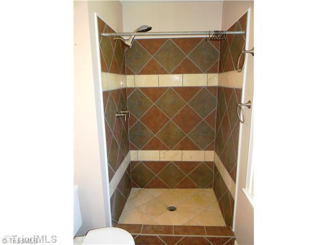 4925 Tower Road, Unit B Greensboro, NC 27410 - Photo 14 of 16 Master Bath/Spa. Tiled Step-In Master s Shower