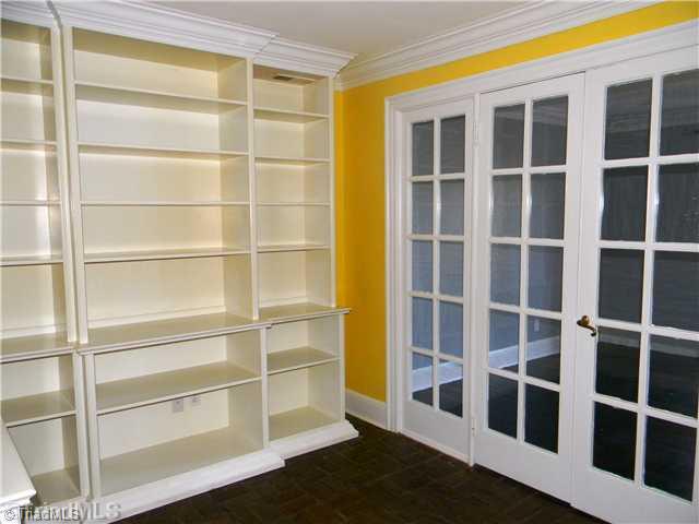 4925 Tower Road, Unit B Greensboro, NC 27410 - Photo 3 of 16 Dining Room. Dining / Library - Beautiful Custom Built-In s Provide a Wonderful Place to Display Your Collections and/or Books. A Wall of French Doors & Windows Open the Space Into the Large Living Room. This home is Loaded with Character and Custom Appointments.