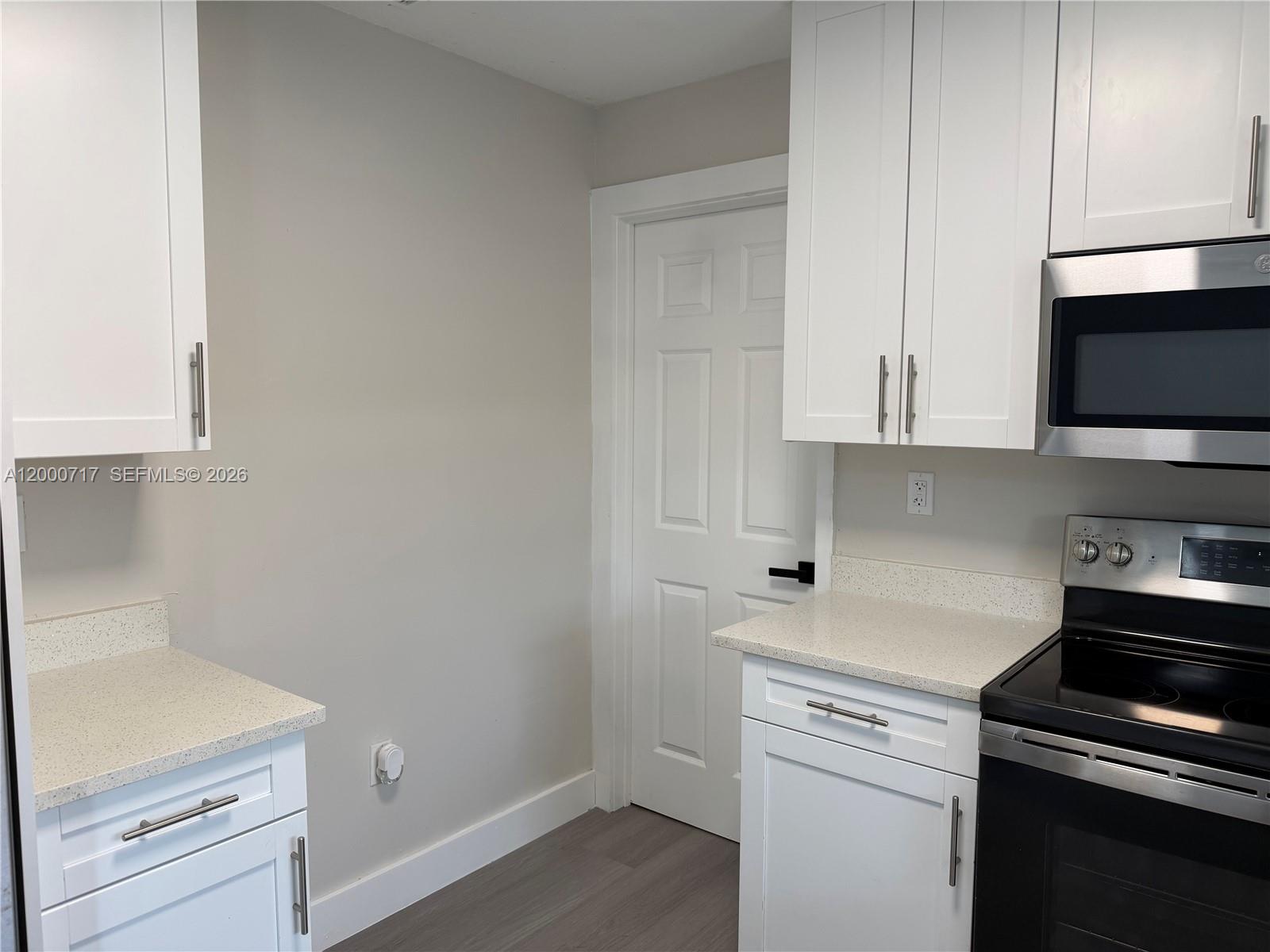 9760 Southwest 210th Street Cutler Bay, FL 33189 - Photo 11 of 17 a kitchen with a sink and cabinets
