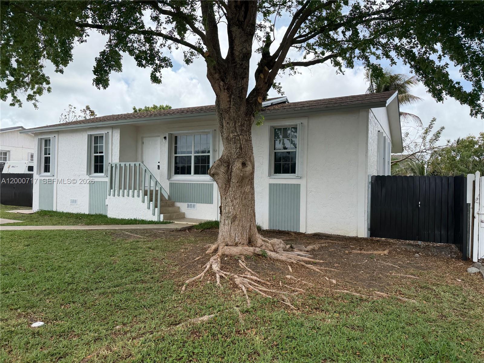 9760 Southwest 210th Street Cutler Bay, FL 33189 - Photo 17 of 17 a front view of house with yard