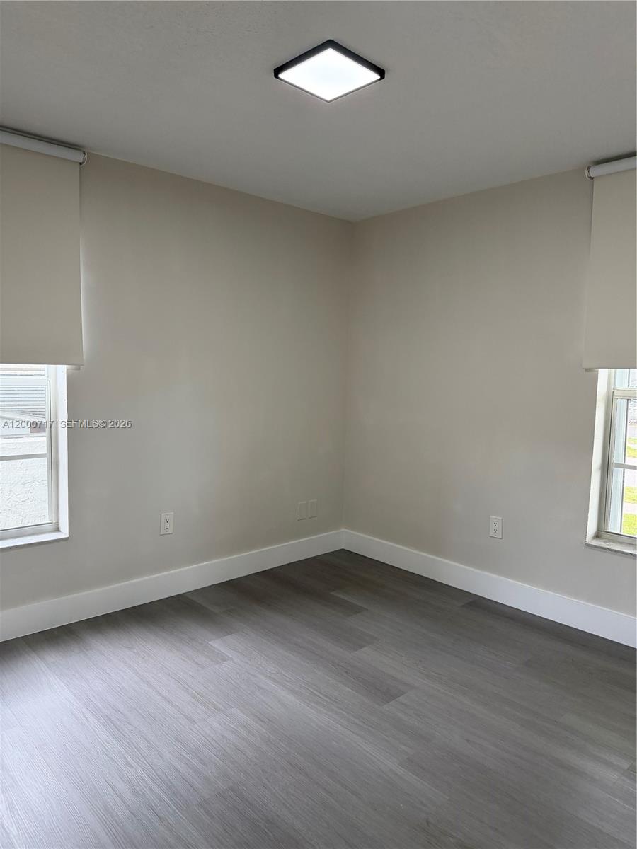 9760 Southwest 210th Street Cutler Bay, FL 33189 - Photo 3 of 17 an empty room with a window