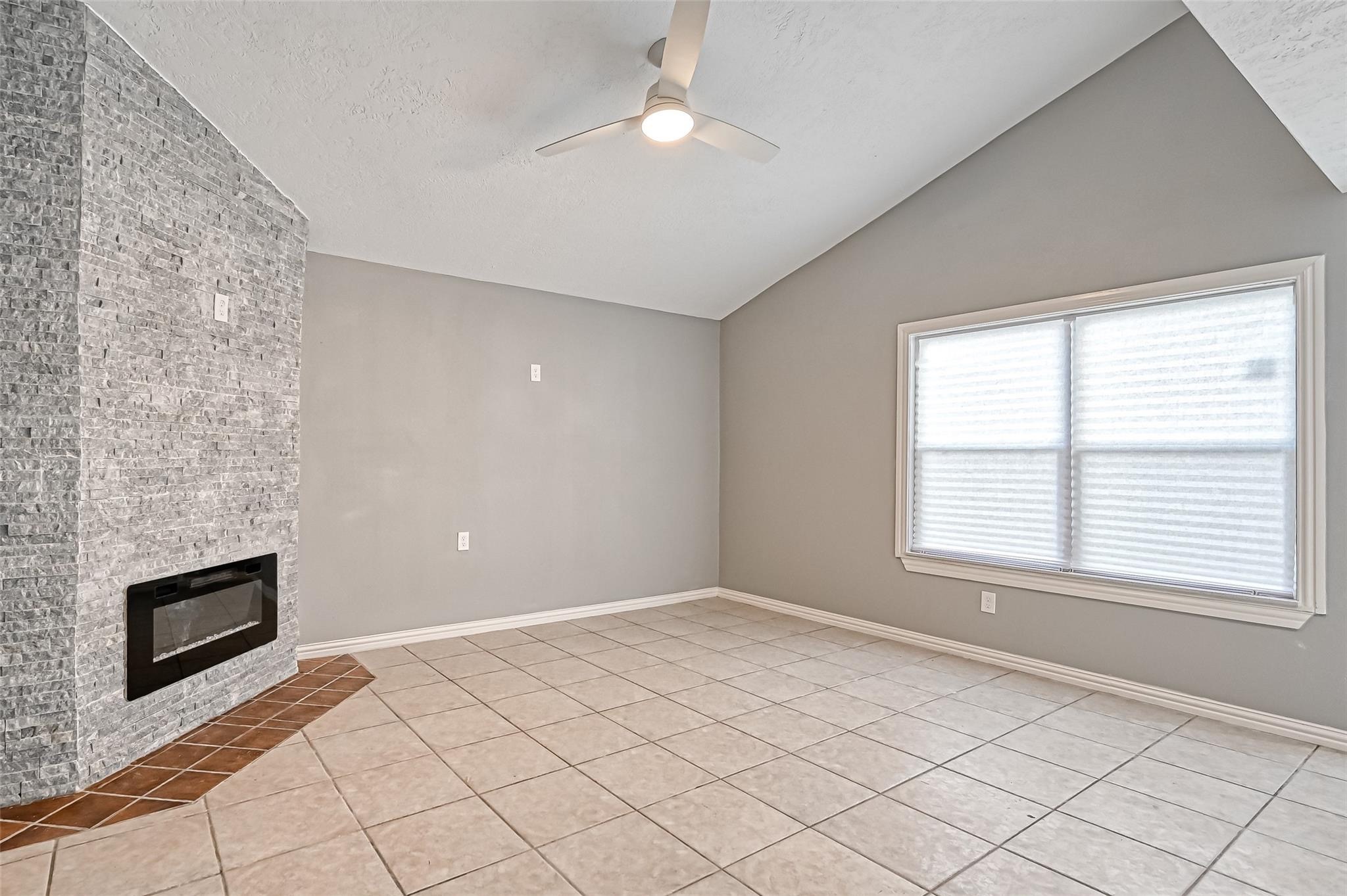 10252 Cottage Field Road Houston, TX 77041 - Photo 2 of 18 an empty room with windows