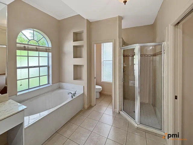 a bathroom with a granite countertop sink mirror and double