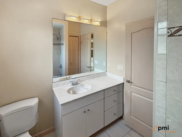 a view of a kitchen with a sink and a chandelier