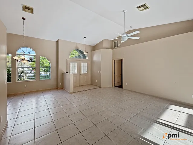 a large kitchen with cabinets and stainless steel appliances