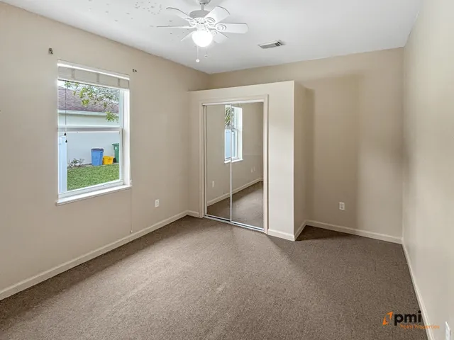 a bathroom with a toilet sink and vanity