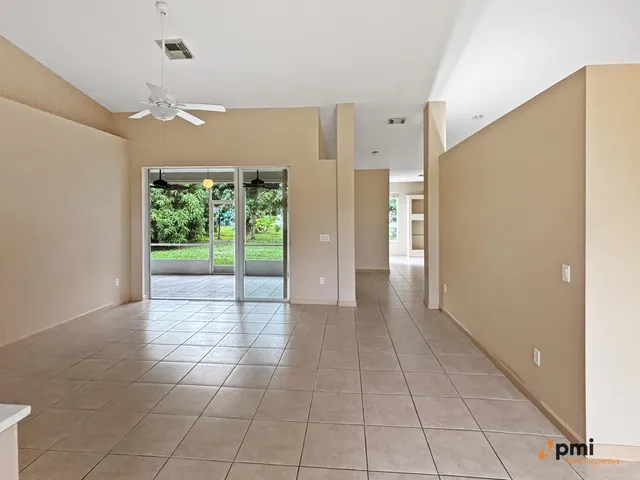 a view of a room with an entryway and chandelier