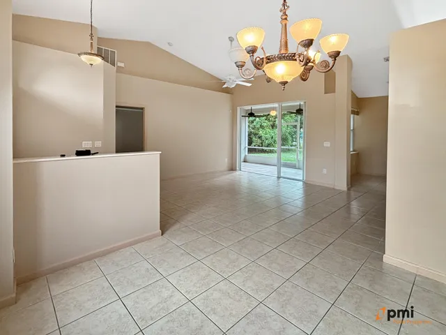 a kitchen with stainless steel appliances granite countertop a stove sink and cabinets