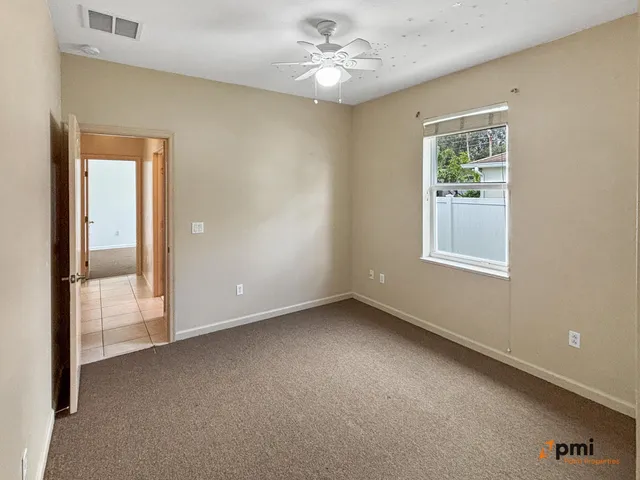 a spacious bathroom with a sink mirror and