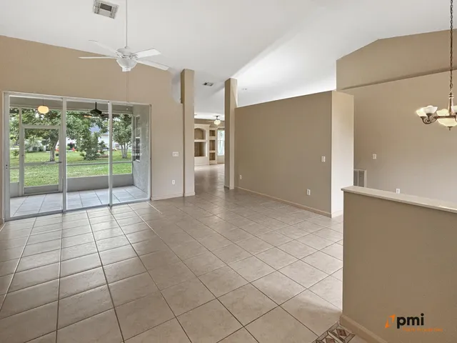 a spacious bathroom with a granite countertop sink and a mirror