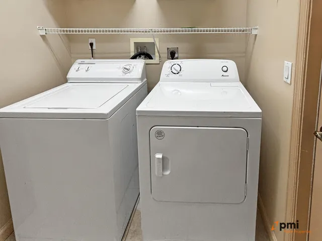 a spacious bathroom with a granite countertop tub shower and a sink
