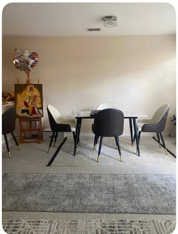 a living room with furniture and a rug