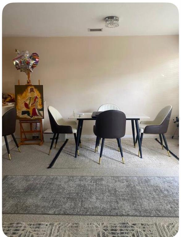 2859 Southwest 38th Place Gainesville, FL 32608 - Photo 3 of 10 a living room with furniture and a rug