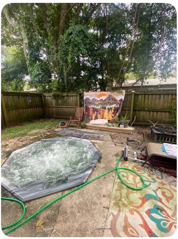 2859 Southwest 38th Place Gainesville, FL 32608 - Photo 10 of 10 a view of a backyard with wooden fence