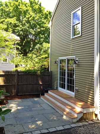 a view of house with outdoor space and sitting area