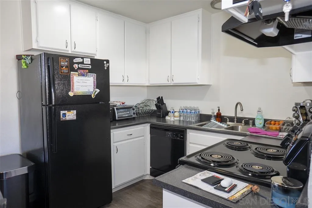 715 B Street Ramona, CA 92065 - Photo 13 of 21 a kitchen with a refrigerator stove and sink