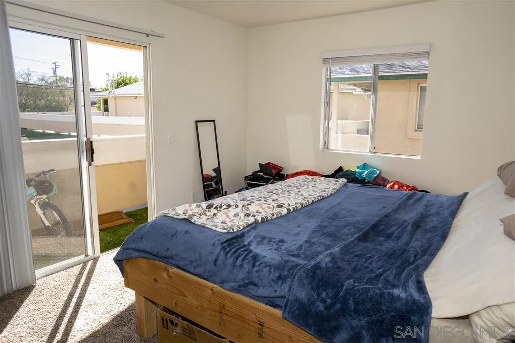715 B Street Ramona, CA 92065 - Photo 19 of 21 a bedroom with a bed and wooden floor