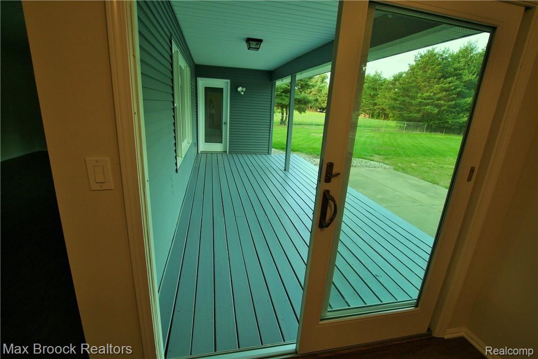 4515 Shepper Road Stockbridge, MI 49285 - Photo 12 of 34 Kitchen opens to deck