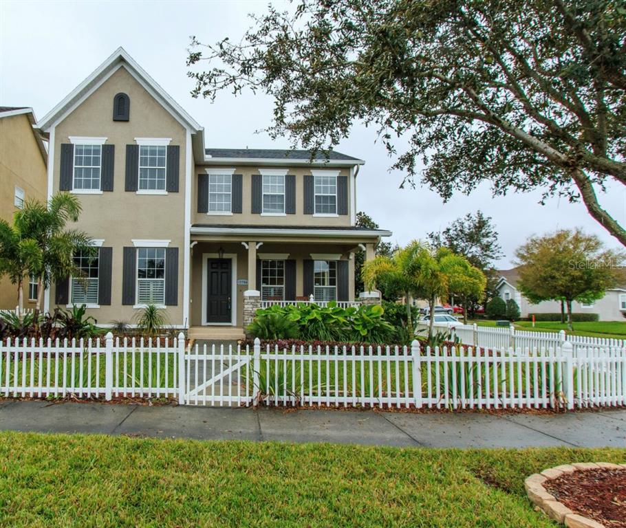 13786 Bluebird Pond Road Windermere, FL 34786 - Photo 1 of 1 a front view of a house with a garden