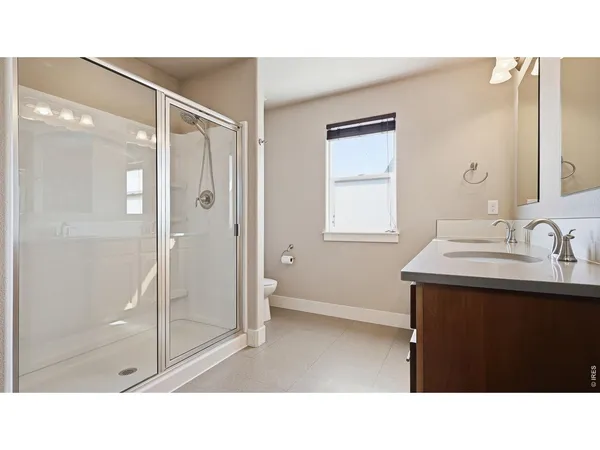 a bathroom with a sink double vanity and a mirror