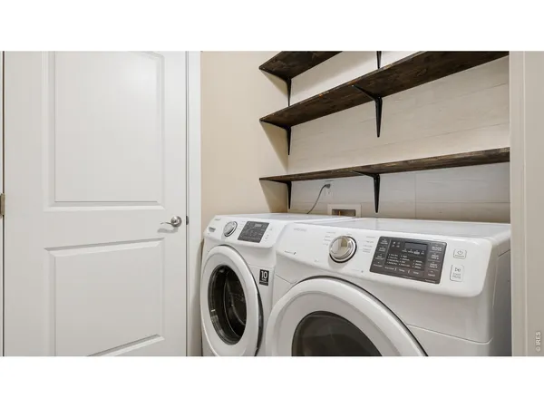 a kitchen with a refrigerator and window