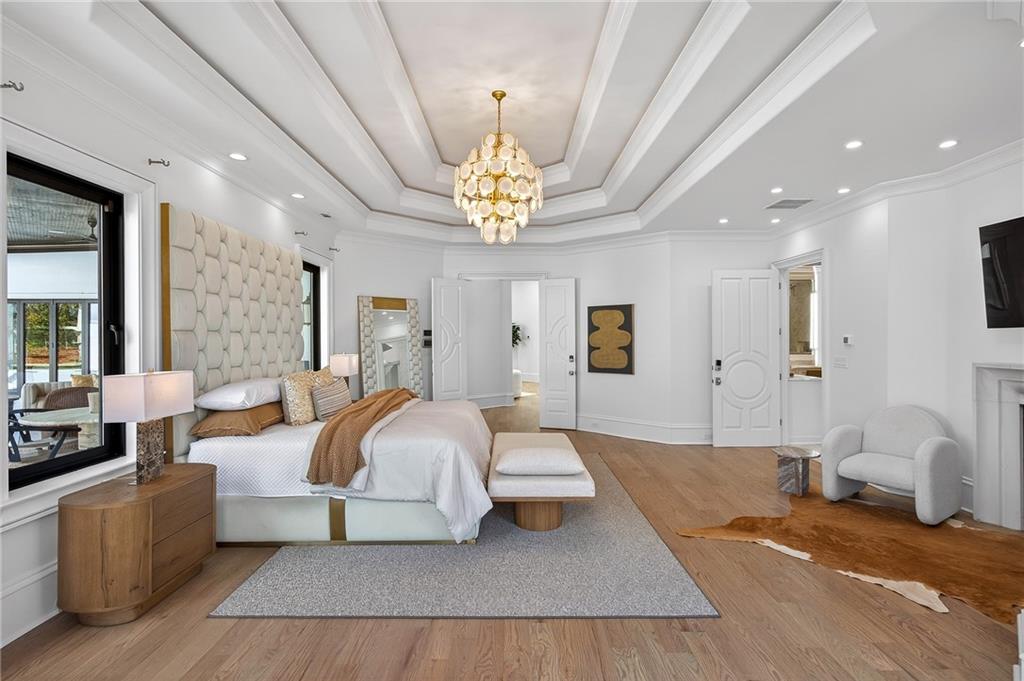 5320 Riverview Road Northwest Atlanta, GA 30339 - Photo 20 of 83 a bedroom with a bed couch chandelier and a window