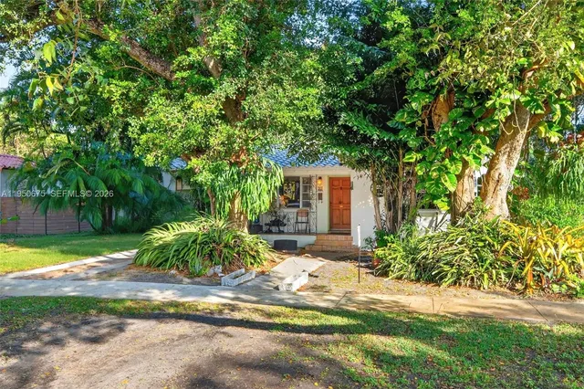 a workspace with wooden floor and windows