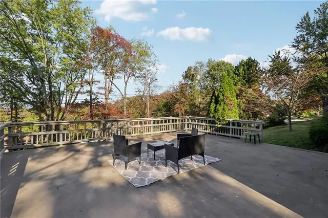 a view of a patio with iron fence