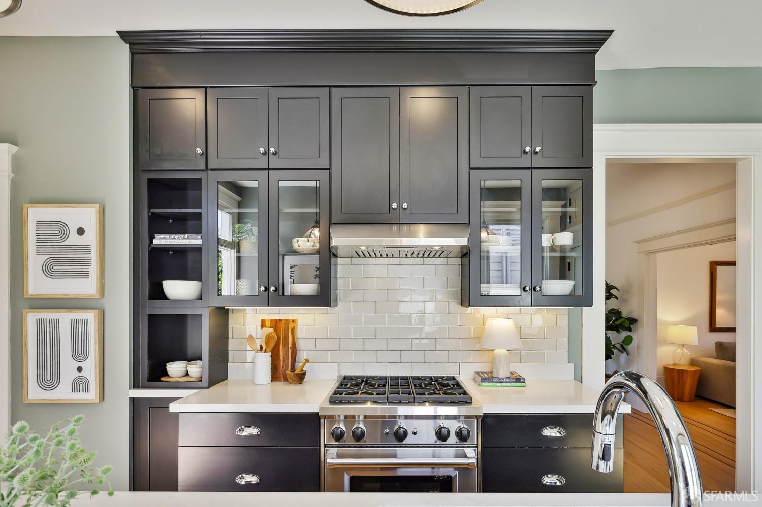 216 Ellsworth Street San Francisco, CA 94110 - Photo 12 of 76 a kitchen with stainless steel appliances granite countertop a stove and a refrigerator
