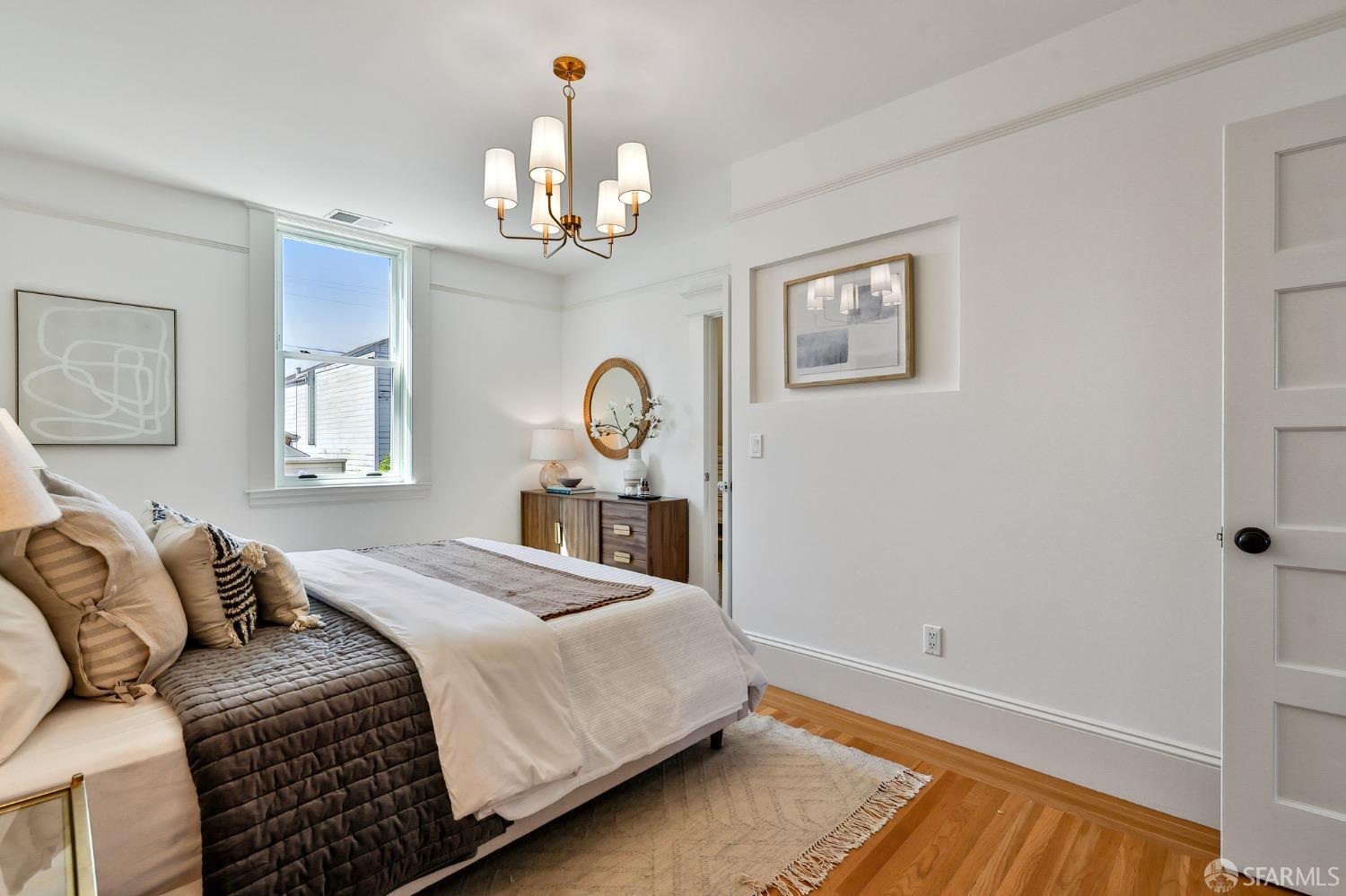 216 Ellsworth Street San Francisco, CA 94110 - Photo 21 of 76 a bedroom with a bed and a window