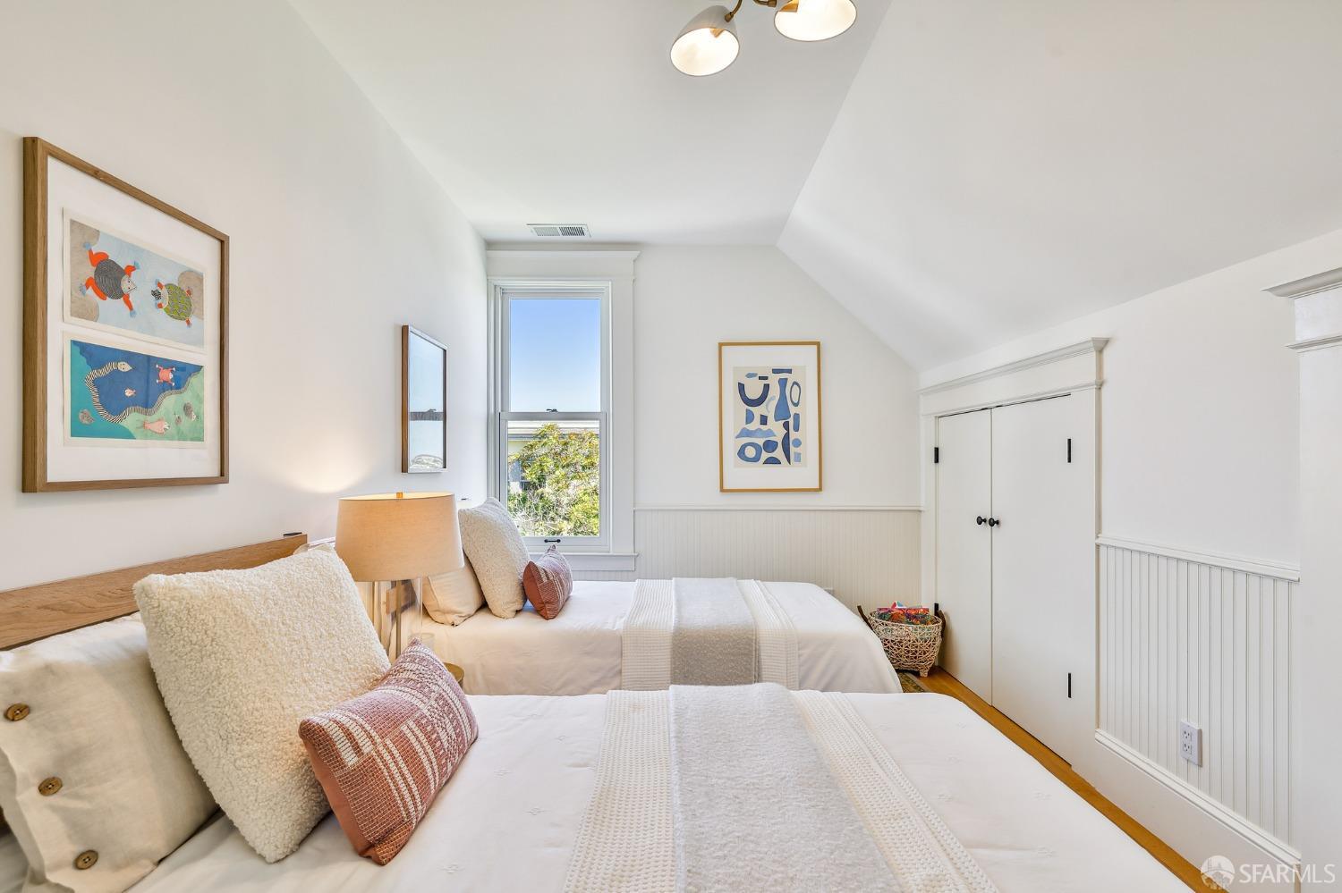 216 Ellsworth Street San Francisco, CA 94110 - Photo 24 of 76 a bedroom with a bed and painting on the wall