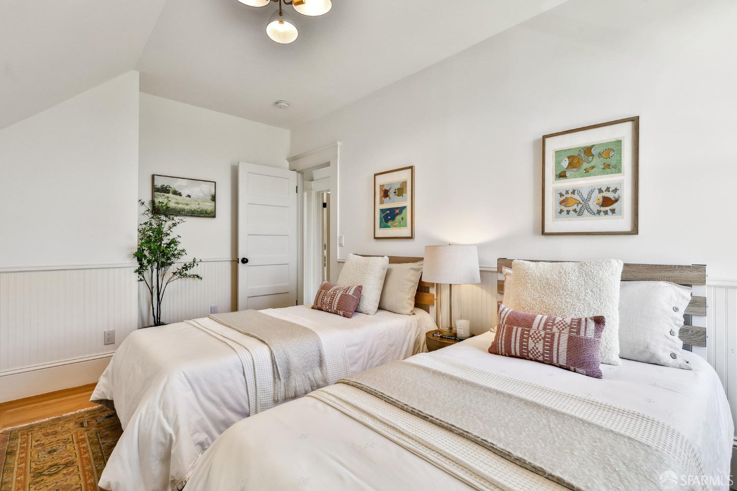 216 Ellsworth Street San Francisco, CA 94110 - Photo 25 of 76 a bedroom with two beds and potted plant
