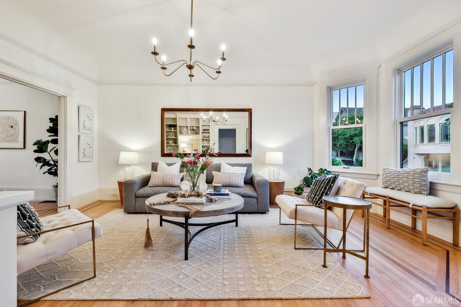 216 Ellsworth Street San Francisco, CA 94110 - Photo 3 of 76 a living room with furniture chandelier and a table