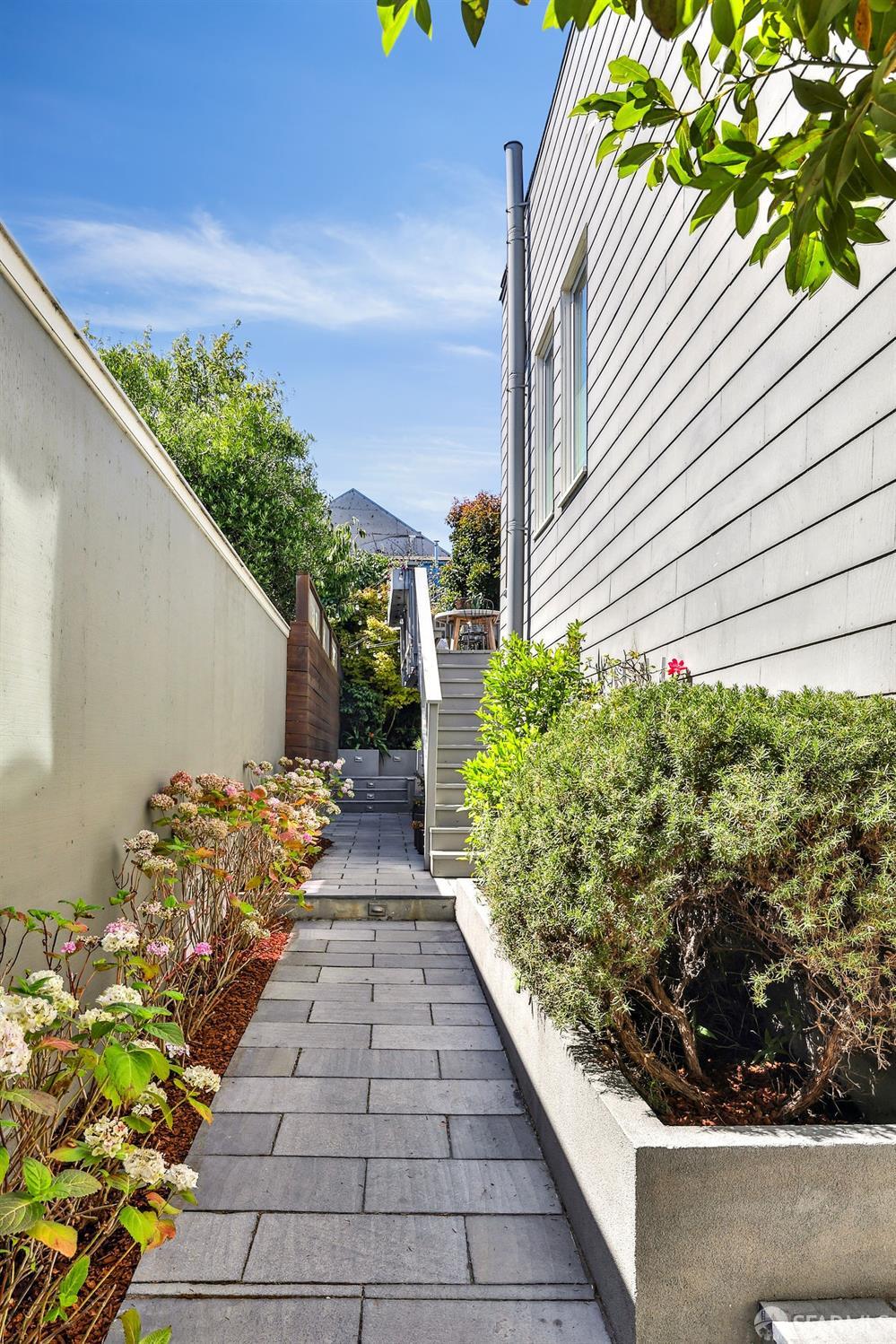 216 Ellsworth Street San Francisco, CA 94110 - Photo 35 of 76 a view of a backyard with potted plants