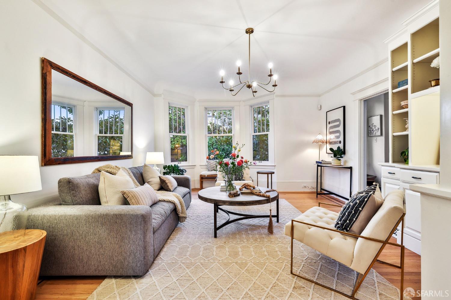 216 Ellsworth Street San Francisco, CA 94110 - Photo 4 of 76 a living room with furniture or chandelier and a wooden floor