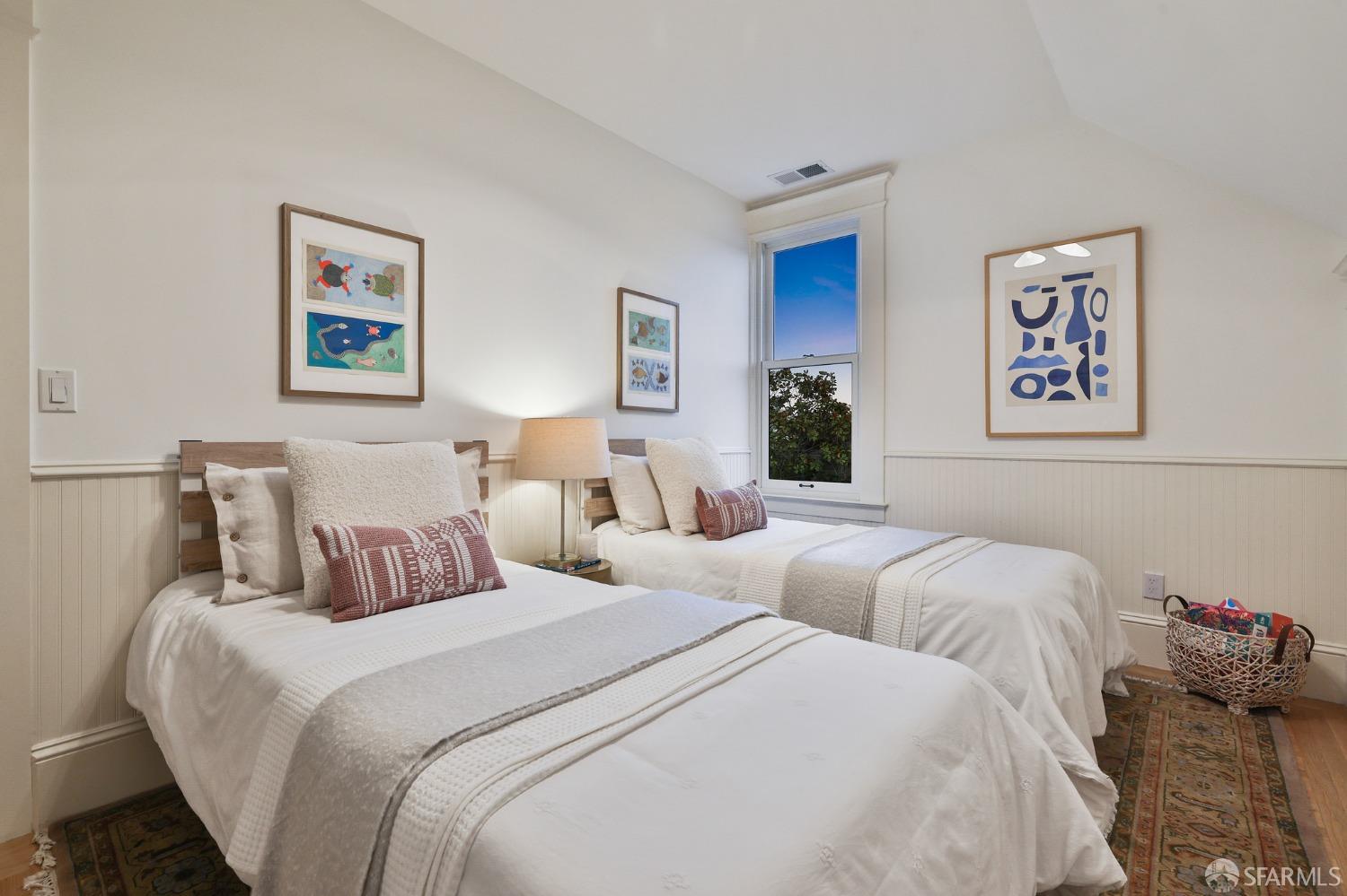 216 Ellsworth Street San Francisco, CA 94110 - Photo 49 of 76 a bedroom with two beds and a couch