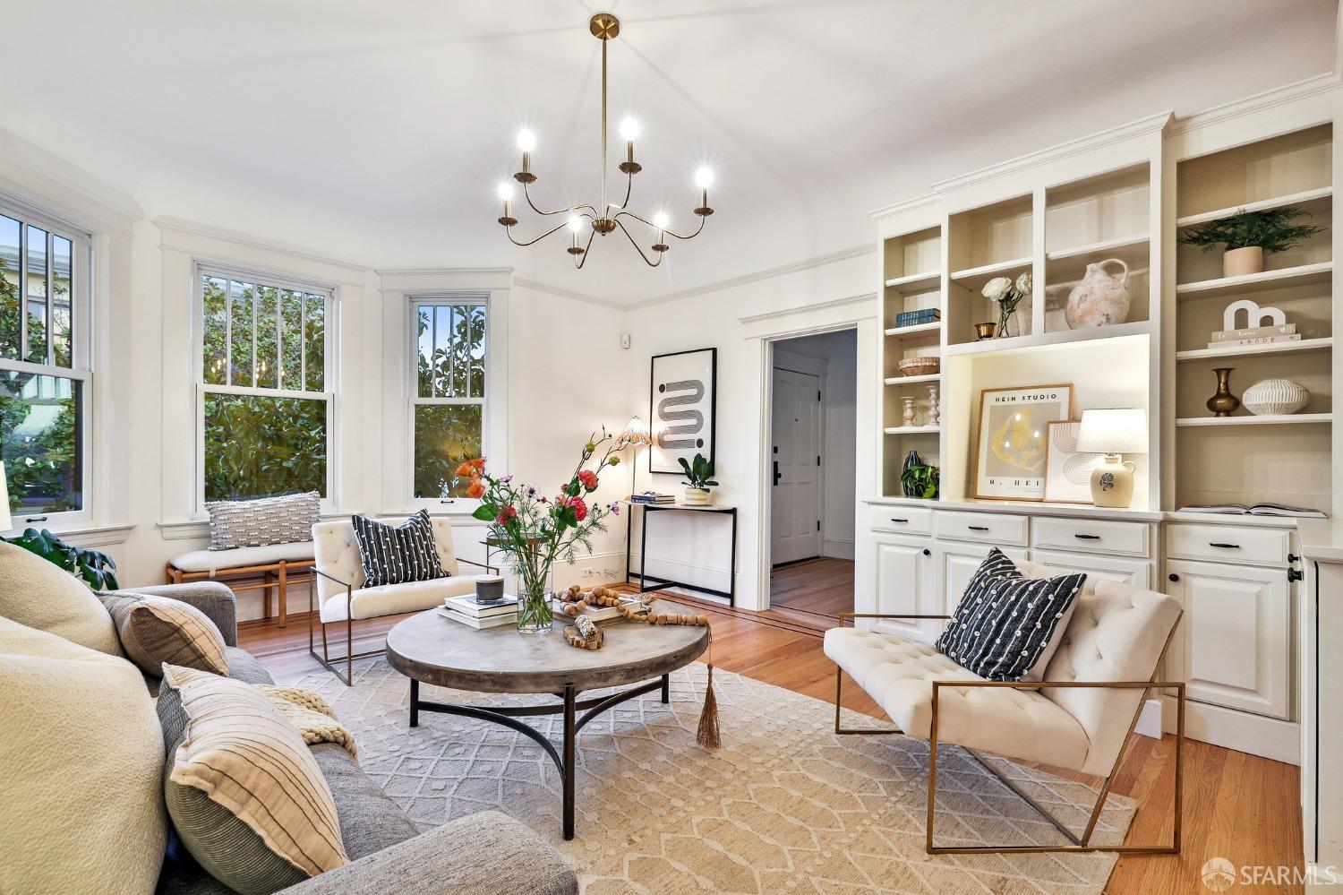 216 Ellsworth Street San Francisco, CA 94110 - Photo 5 of 76 a living room with furniture a chandelier and a table