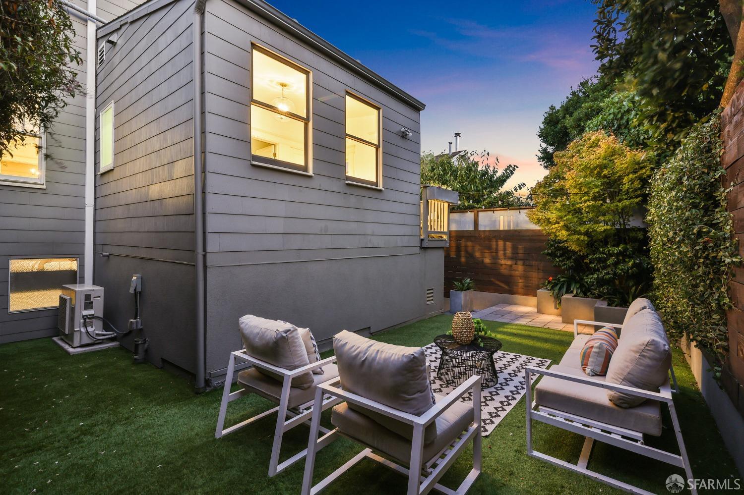 216 Ellsworth Street San Francisco, CA 94110 - Photo 60 of 76 a backyard of a house with table and chairs